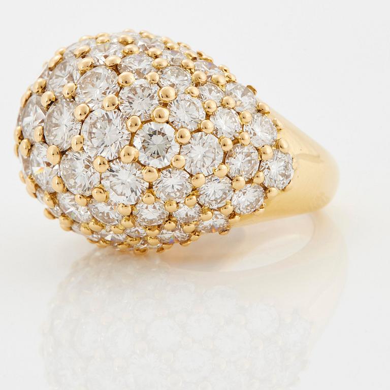 Cartier "Marrakech" an 18K gold bombé ring set with round brilliant-cut diamonds.