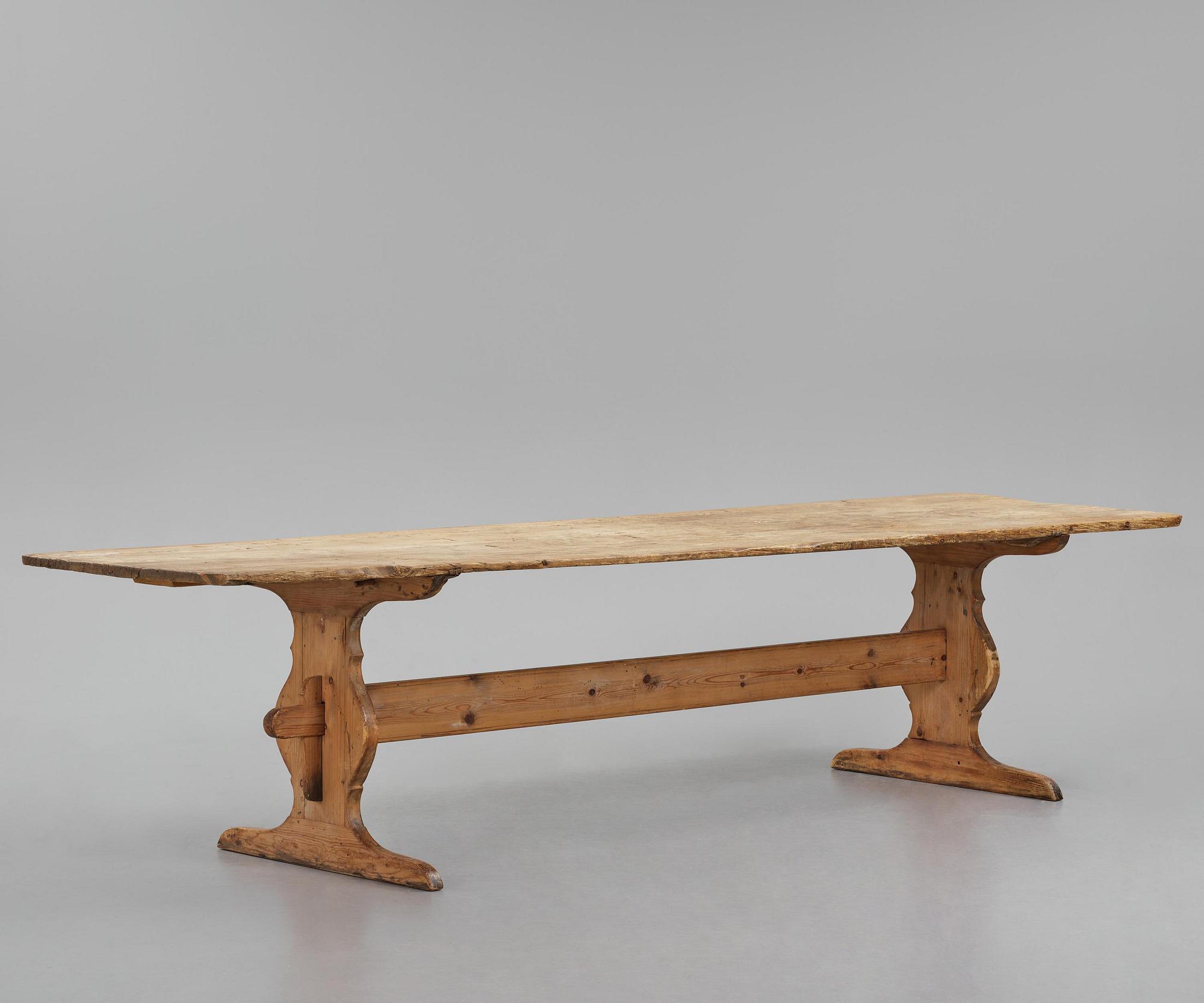 A pine trestle table, 20th century incorporating older elements.