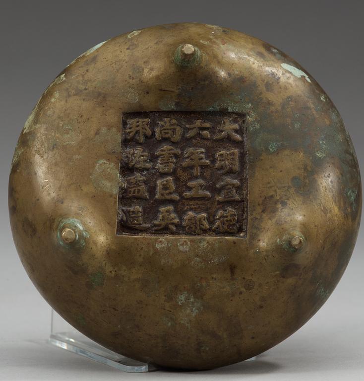 A bronze tripod censer, Qing dynasty with a inscription and Xuande mark, dated to sixth year of Xuande (corresponding to 1431).