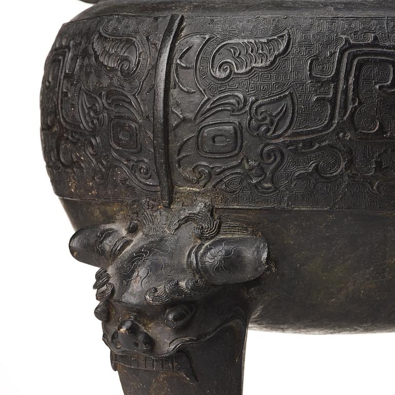 A large bronze censer with cover, presumably late Ming dynasty (1368-1644).