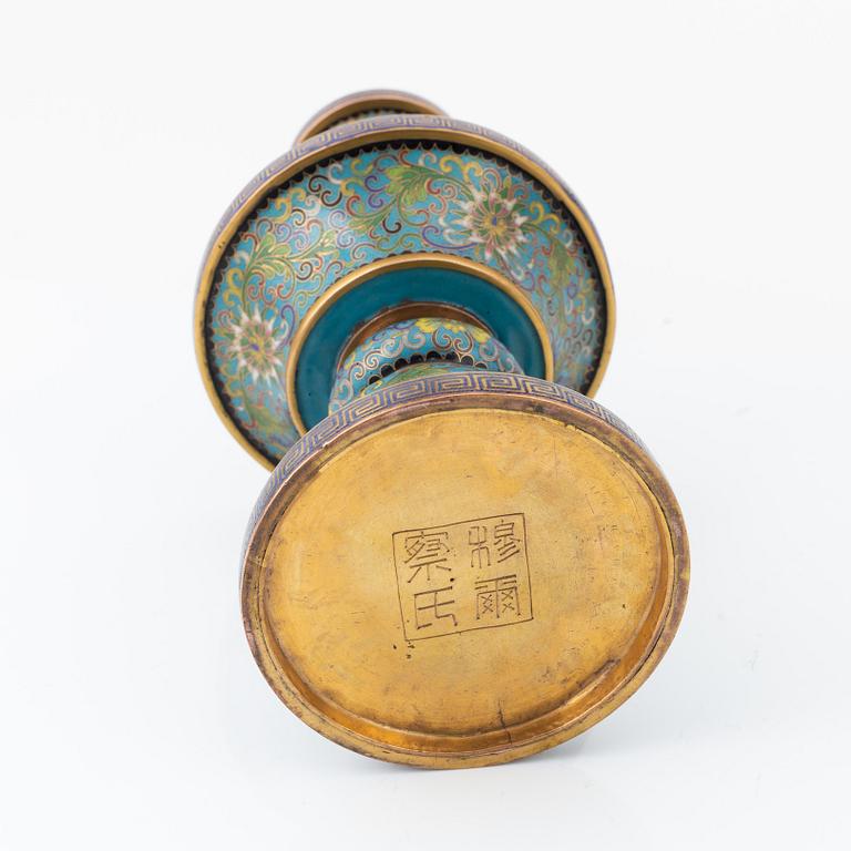 A Chinese cloisonné vase, a bowl and a candlestick, 20th Century.