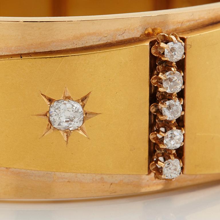 An 18K gold bracelet set with old-cut diamonds.