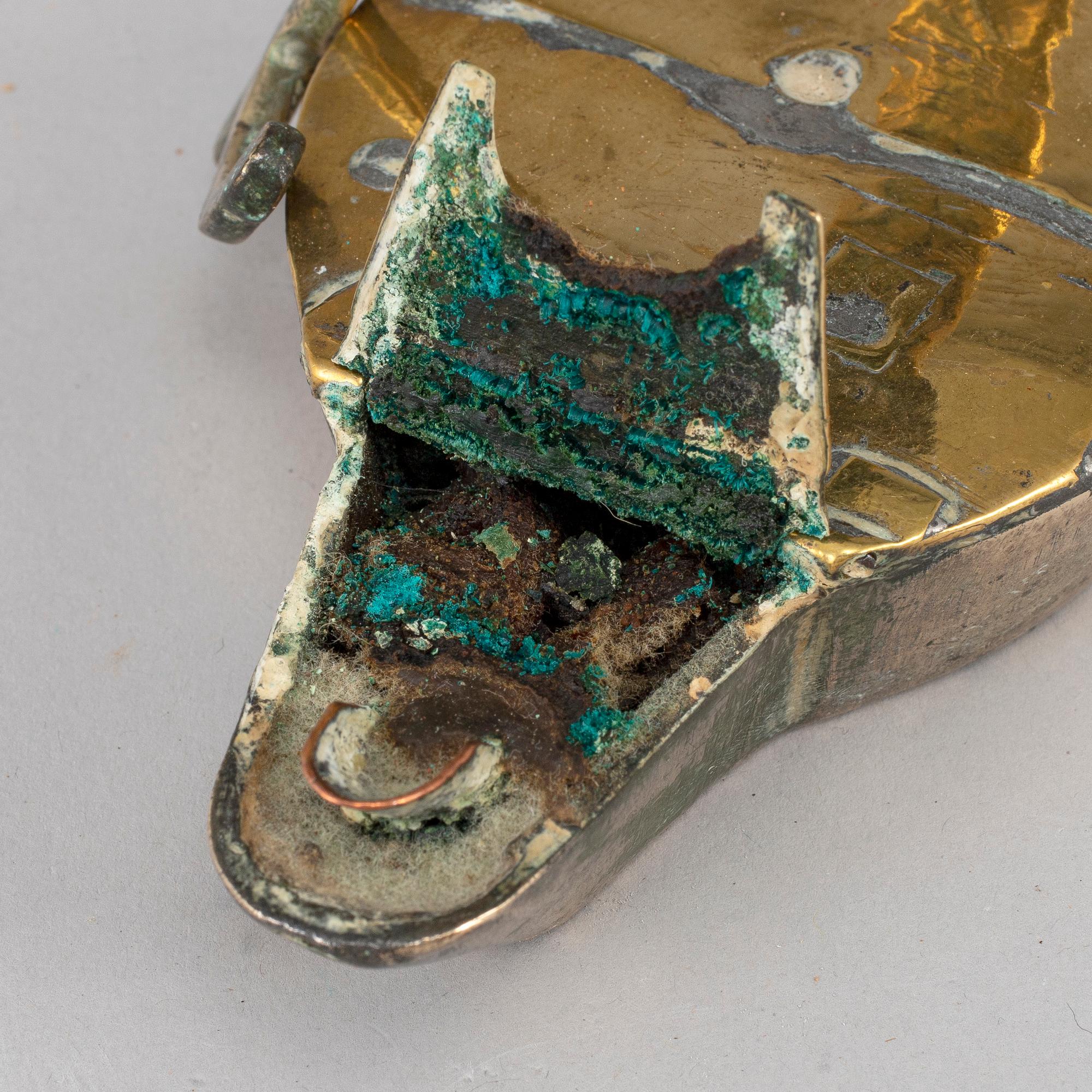 An 18th century bronze oil lamp.