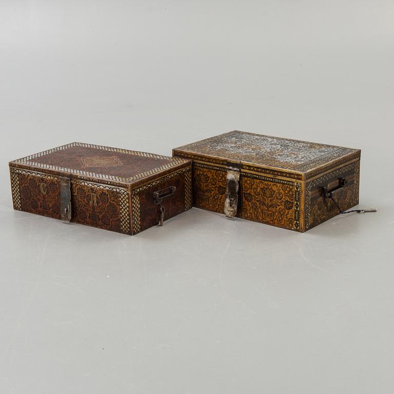 Two perisan metal safety boxes, early 20th Century, one of them with a Russian inkription and dating to 1928.