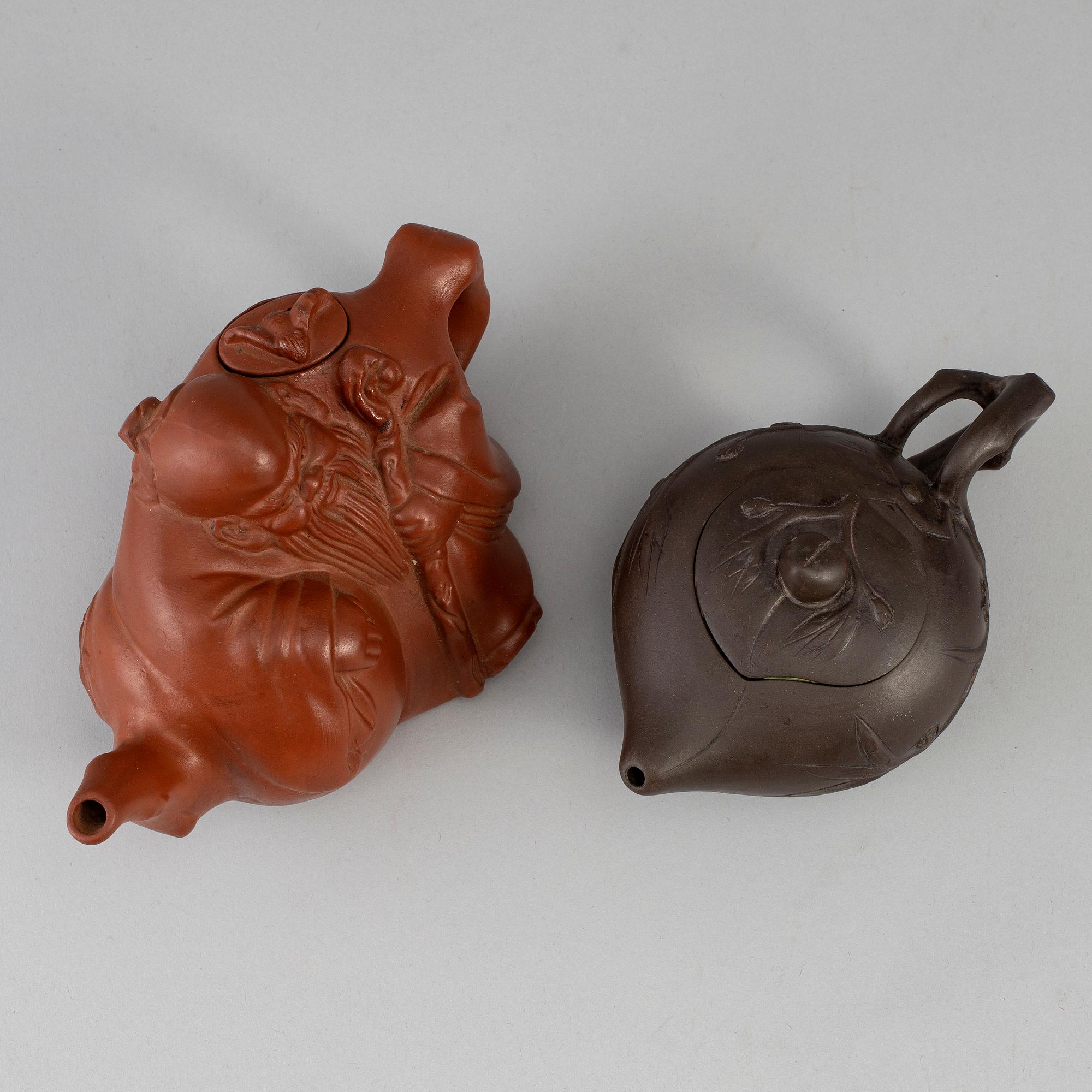 Two Yixing tea pots with cover, China, 20th Century.