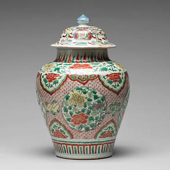 572. A Transitional wucai baluster vase with cover, 17th Century.