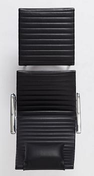 Charles & Ray Eames, an armchair and ottoman, Aluminium group model "EA 316", Vitra, 21st century.