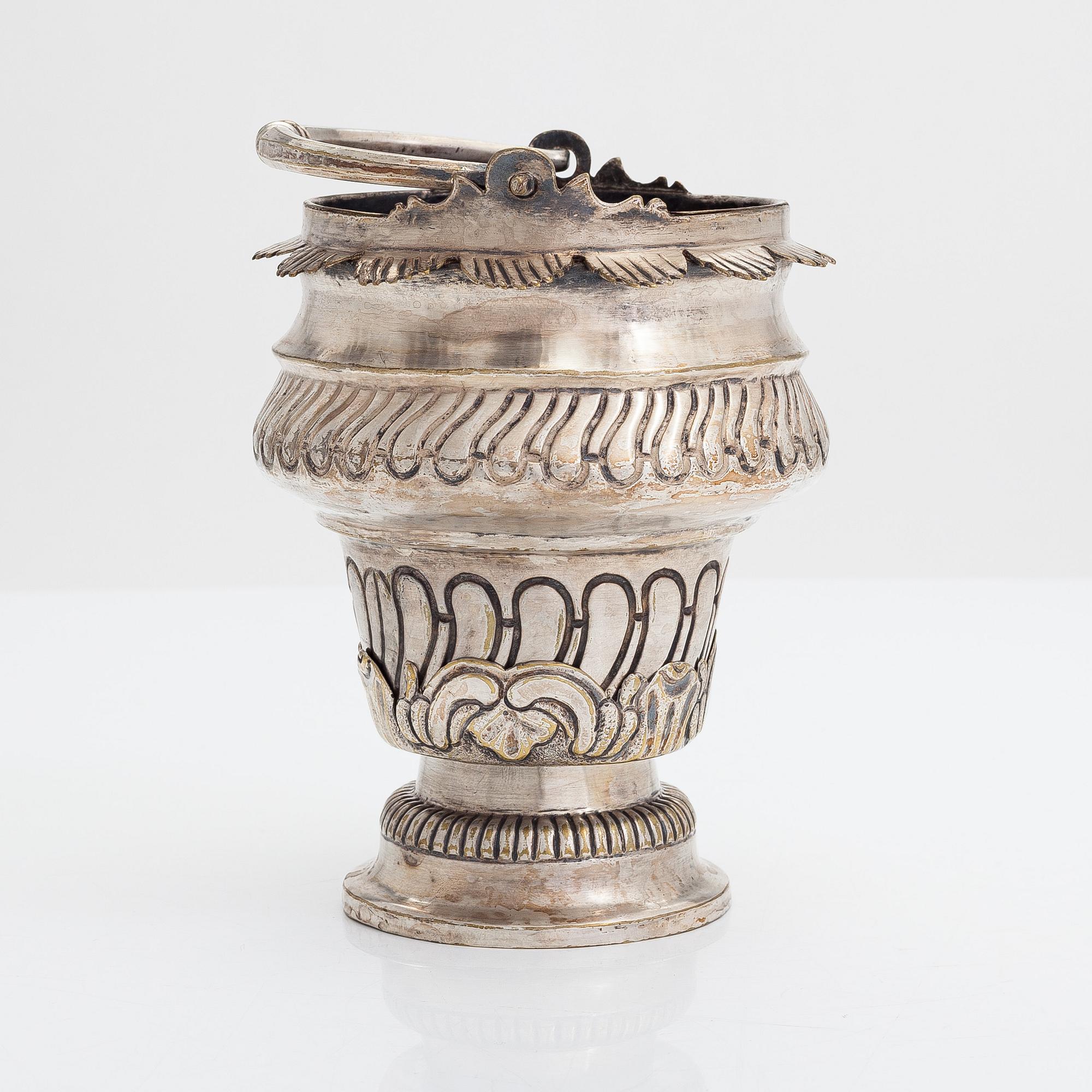 A silver plated brass Holy water bowl stamped L.G and dated 1774.