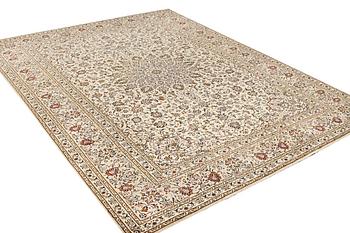 A Kashan carpet, a. 405 x 295 cm.