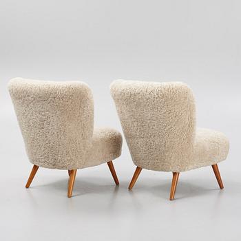 A pair of mid 20th Century easy chairs.