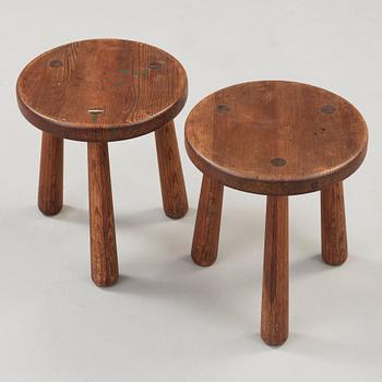 Axel Einar Hjorth, a pair of stained pine 'Utö' stools, Nordiska Kompaniet, Sweden ca 1930.