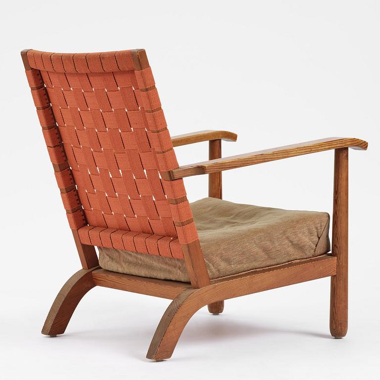 Axel Einar Hjorth, a stained pine "Väddö" easy chair, Nordiska Kompaniet, Sweden, 1930s-40s.