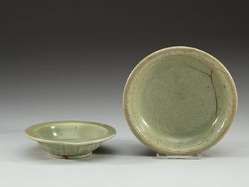 A celadon glazed double fish dish, and a hot water dish, Yuan dynasty (1271-1368).