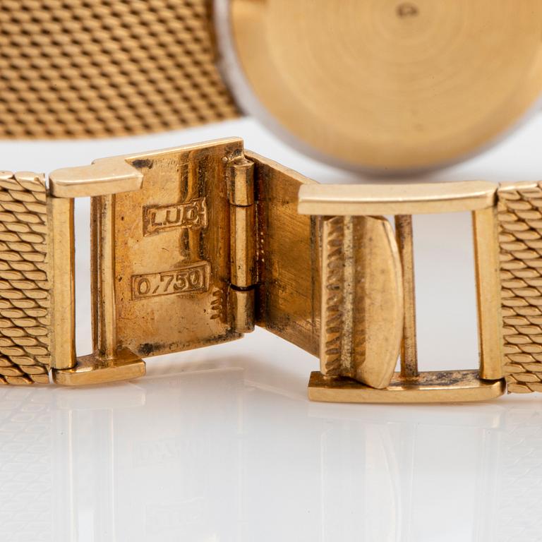 A Chopard wrist watch in 18K gold set with eight-cut diamonds.