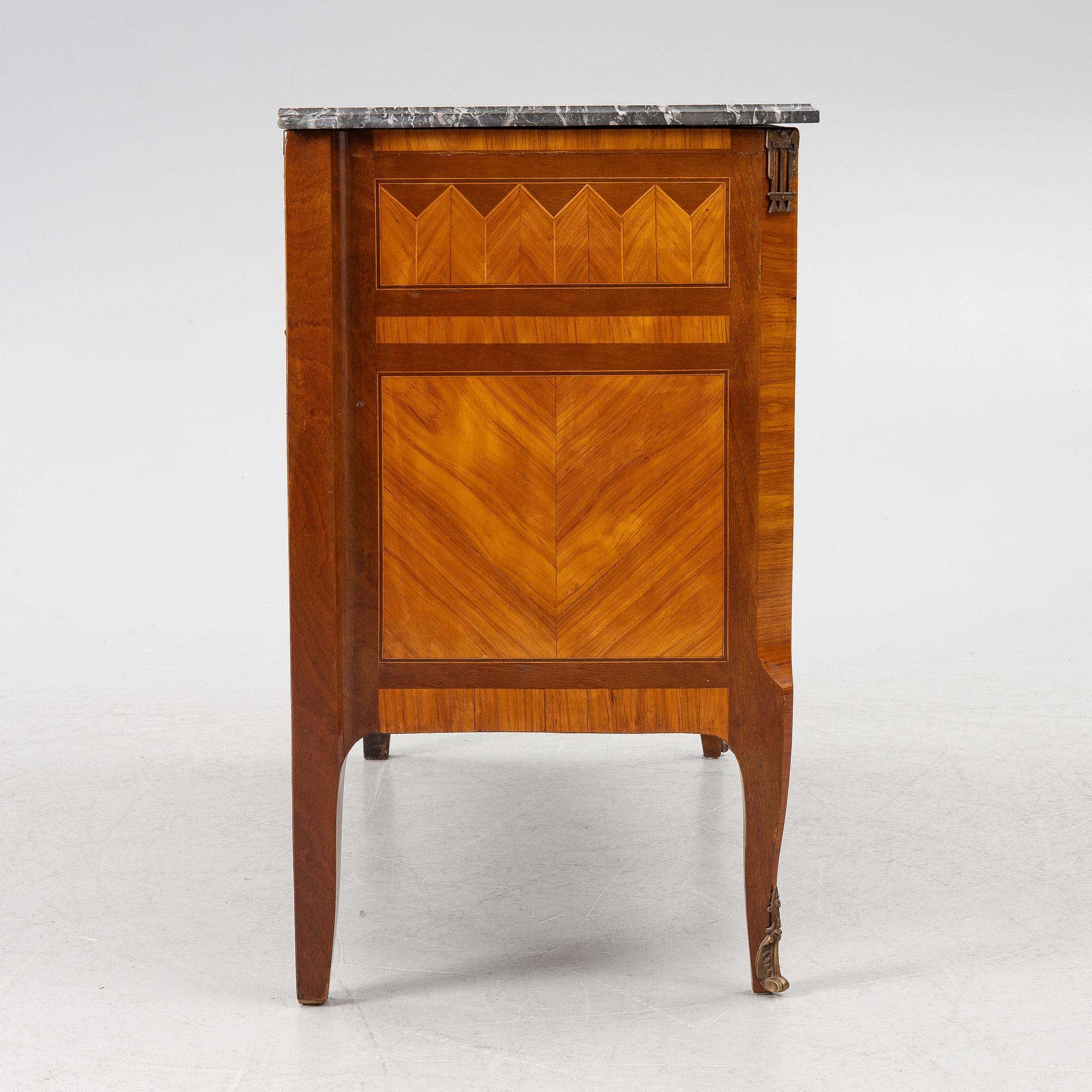 A Louis XVI style chest of drawers, France, circa 1900.