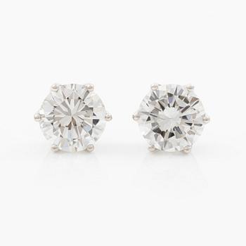 Earrings, single-stone earrings in 18K white gold with brilliant-cut diamonds, accompanied by IGI report.