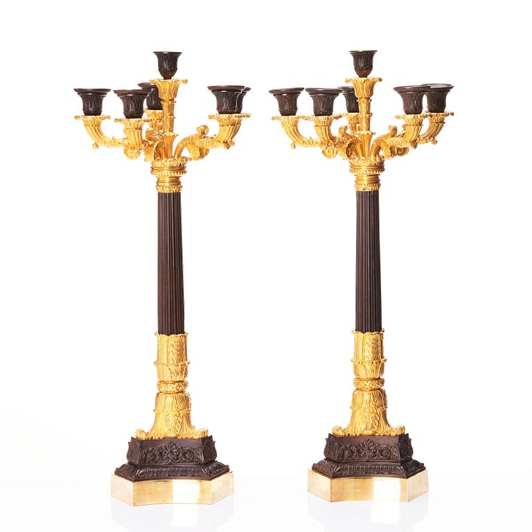 A pair of French Louis Philippe six light candelabra, around 1830.