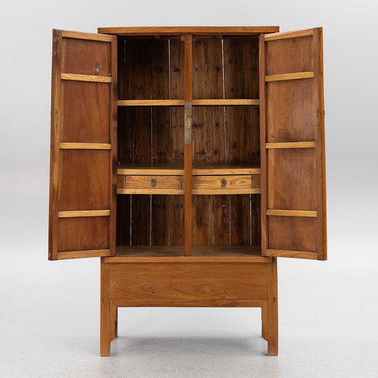 A Chinese hardwood cabinet, 20th century.