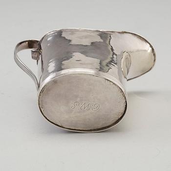 a 1824's silver creamer.