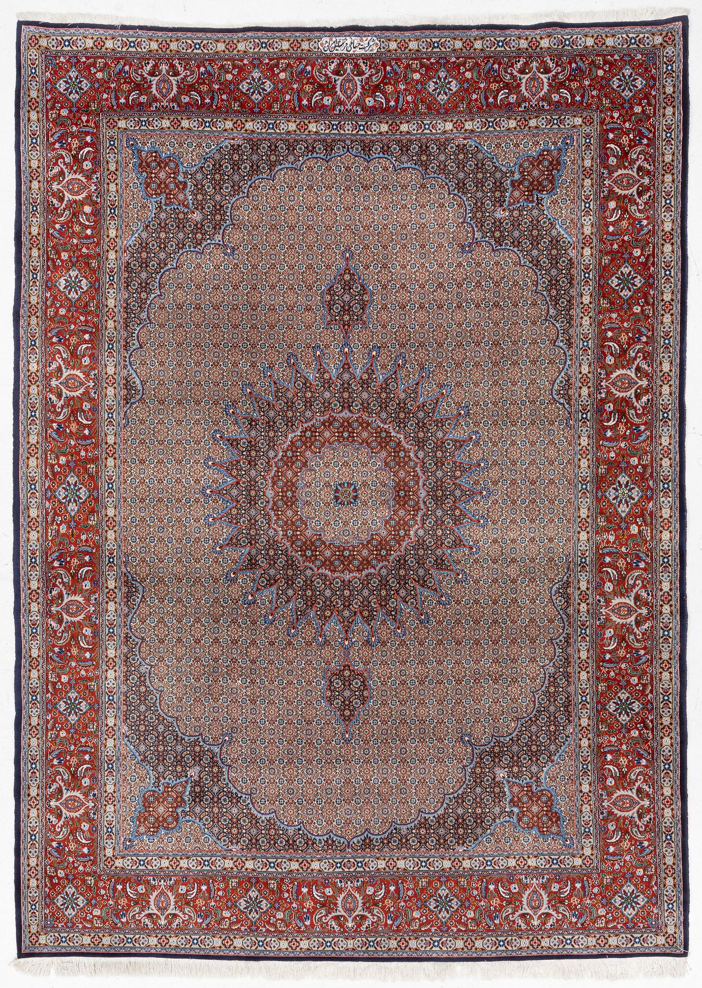 A Moud carpet, part silk, signed, c. 345 x 249 cm.