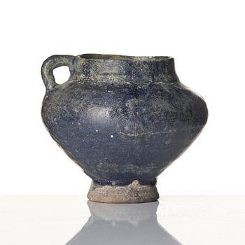 A blue-glazed Nishapur pottery Jug, Persia, 13th century.