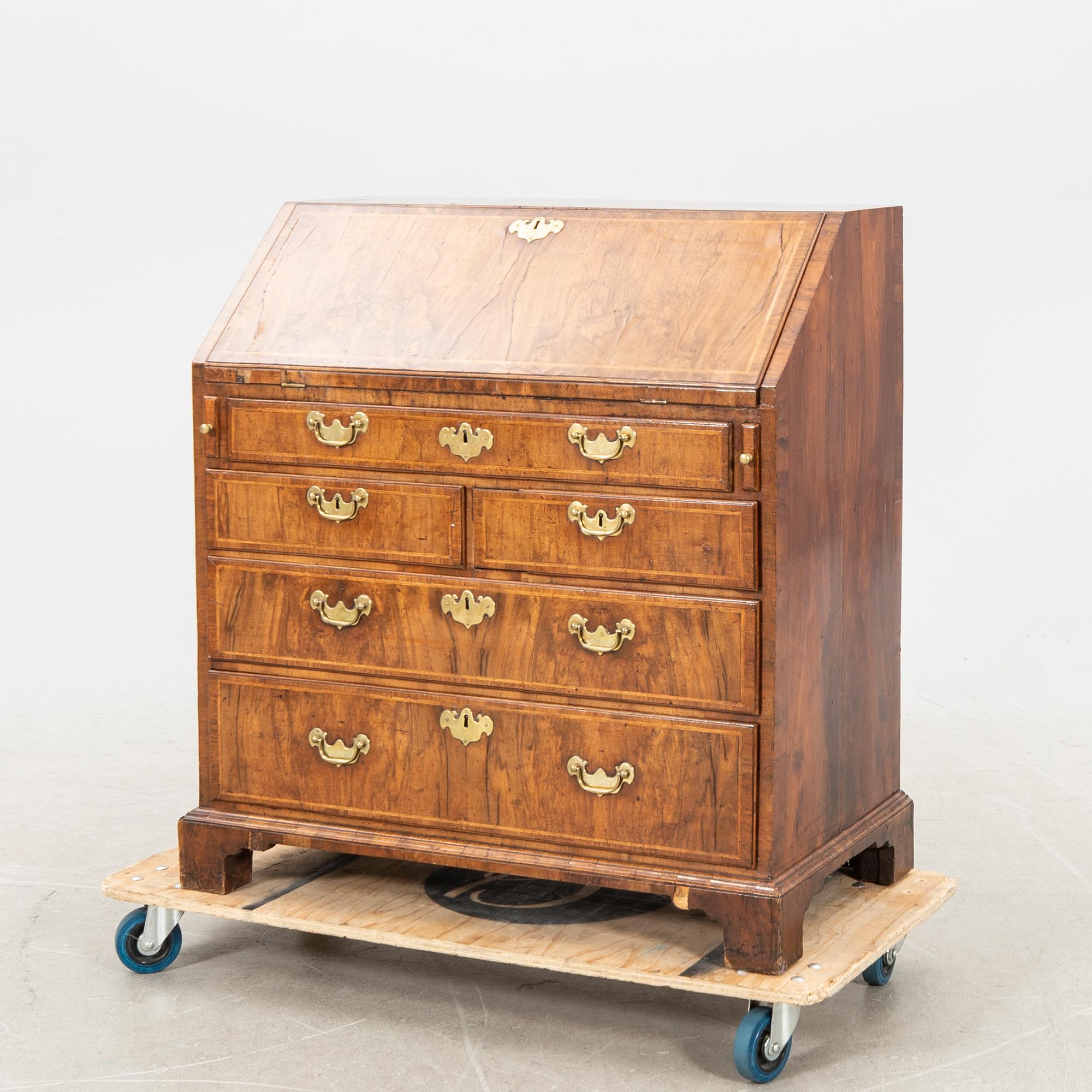 A walnut and mahogany writing bureau, mid-18th century late Baroque.
