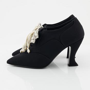 Chanel, a pair of pearl and strass bow pumps, size 37.