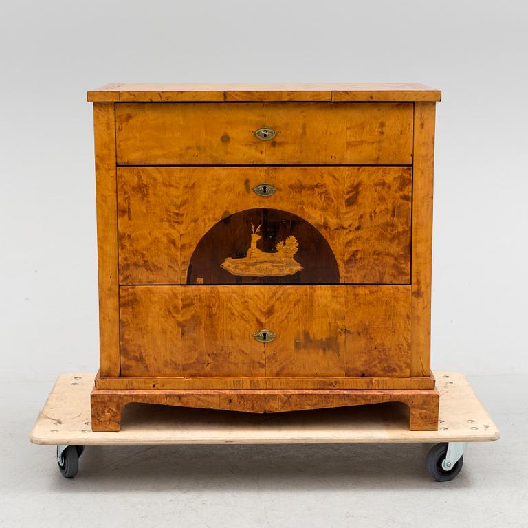 A mid 19th century chest of three drawers.