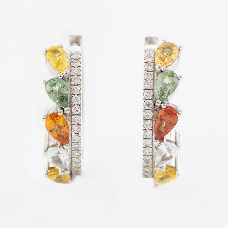 A pair of 14K gold earrings with multicoloured sapphires and diamonds.
