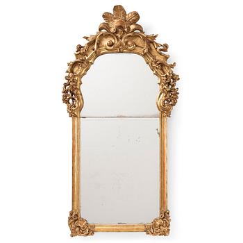 A presumably German giltwood rococo mirror, mid 18th century.