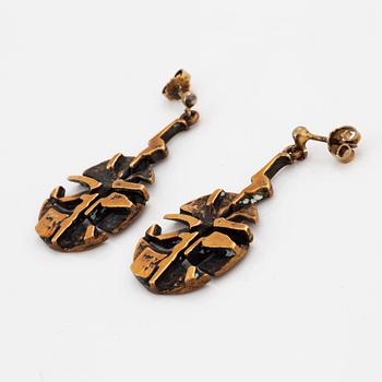 A pair of Jorma Laine earrings in bronze.