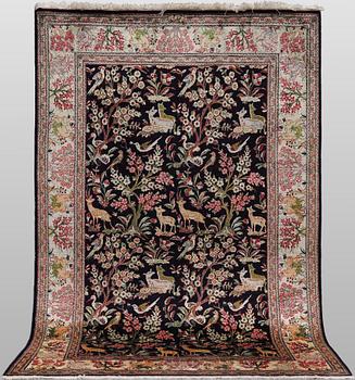 A silk Ghom rug, 155 x 100 cm.