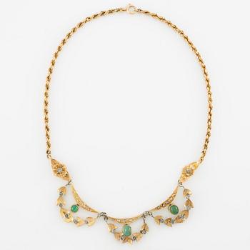 Necklace and bracelet in with floral motif set with cabochon-cut emeralds and rose-cut diamonds.