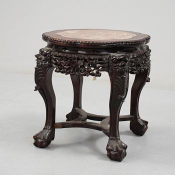 A Chinese hardwood table with marble top, 20th Century.