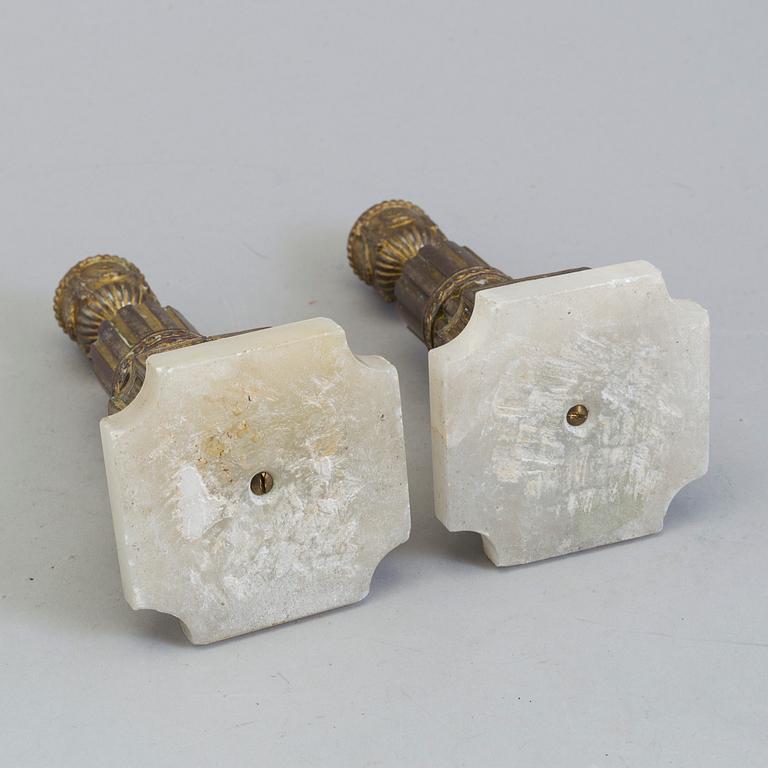 A PAIR OF BRASS AND ALABASTER GUSTAVIAN STYLE CANDLESTICKS, 19th century.