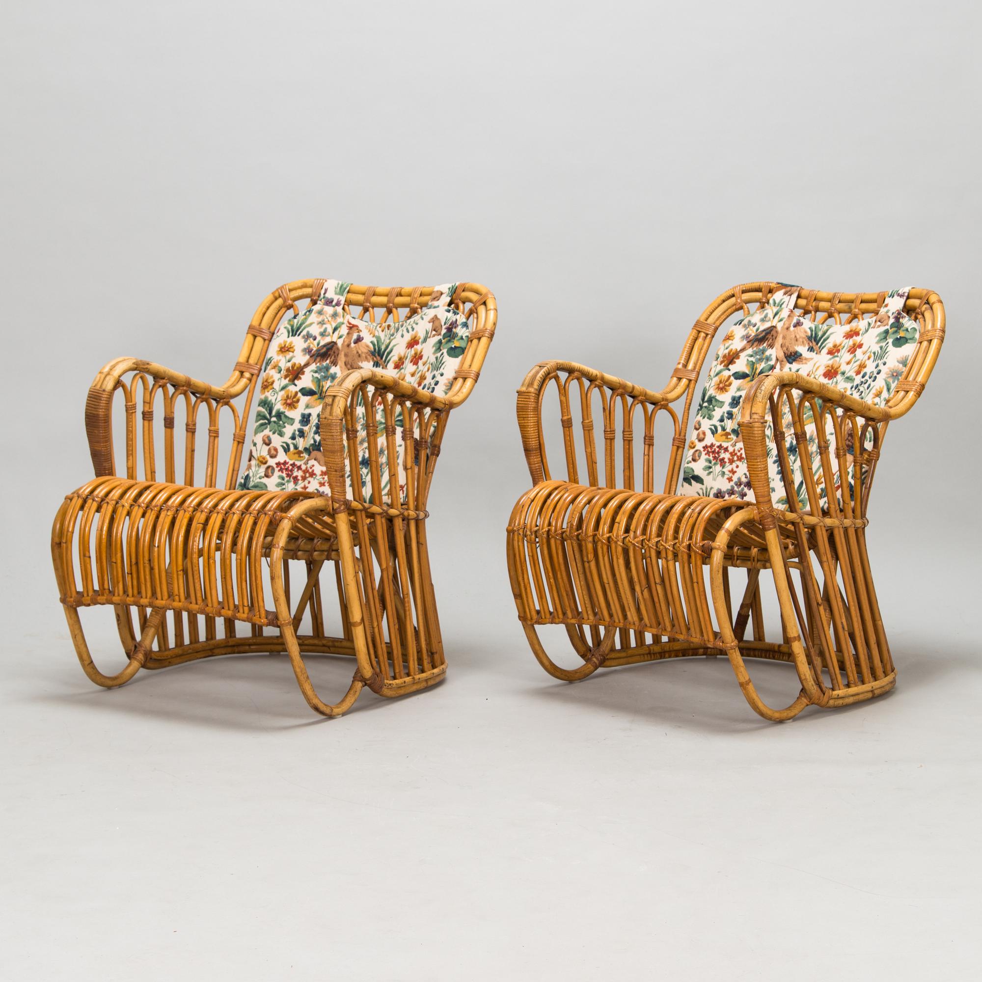 A pair of mid-20th-century rattan armchairs.