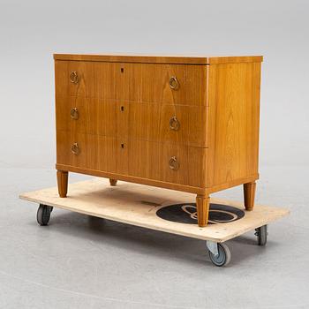 An elm wood veneered dresser, mid 20th Century.