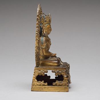 A gilt bronze seated figure of Amitayus, Qing dynasty, Qianlong period, dated by inscription.