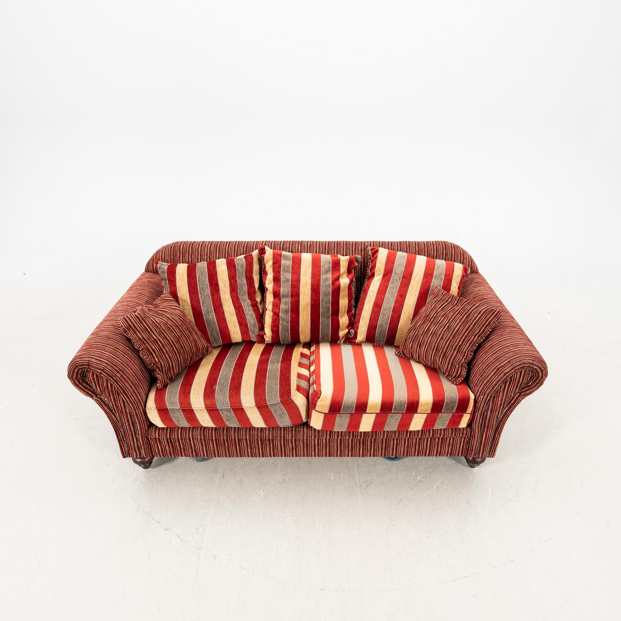 A sofa,with pillows. later part of the 20th Century.