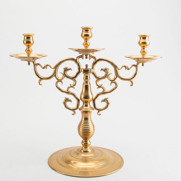 A pair of brass candelabras Gusum around 1900.