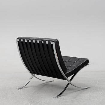LUDWIG MIES VAN DER ROHE, a 'Barcelona' black leather lounge chair, Knoll Studio.