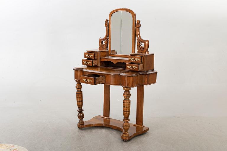 A second half of the 19th century table with mirror and a stool.