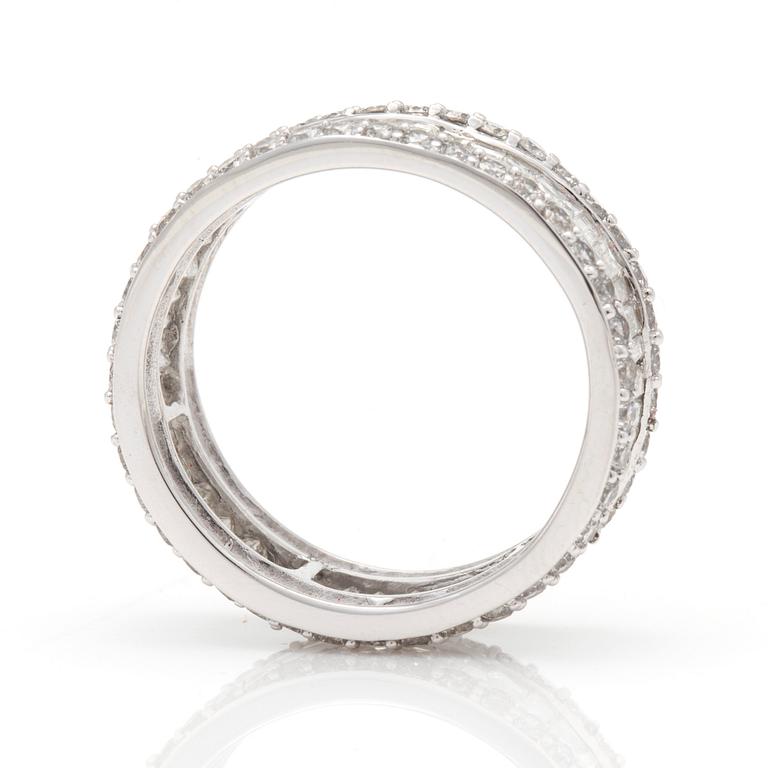 A ring with round, brilliant-cut and tapered, baguette-cut diamonds.