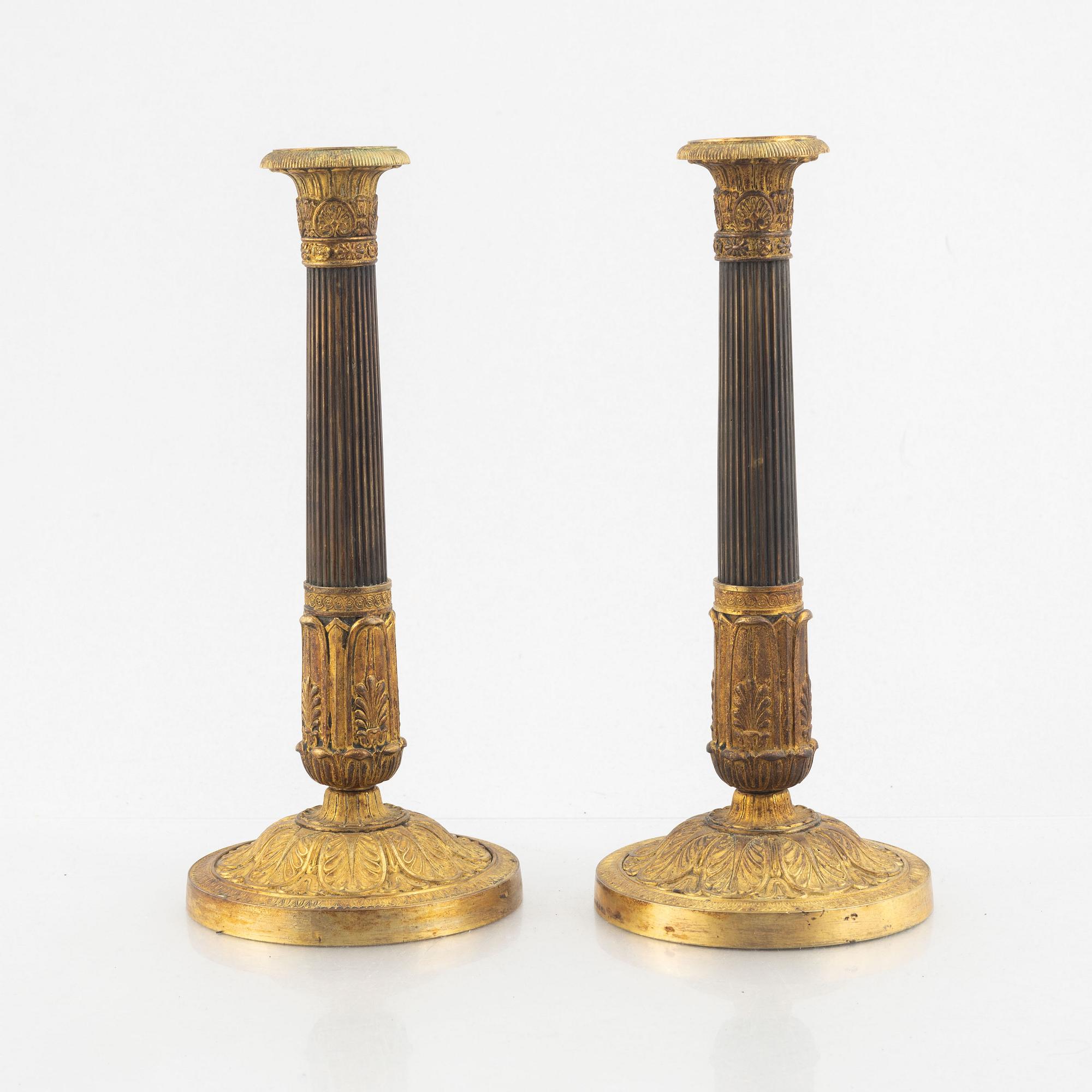 A pair of Empire candle sticks, 19th century.