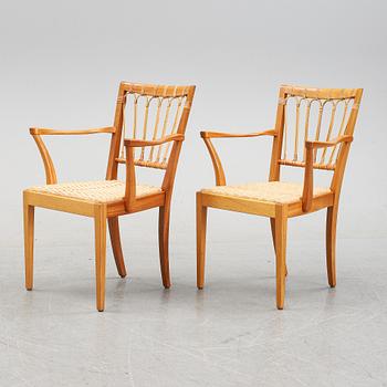 A pair of mahogany armchairs, model 1165, designed by Josef Frank in 1946 for Firma Svenskt Tenn.