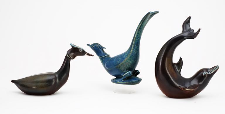 Three Gunnar Nylund stoneware figures, a dolphin, a pheasant and a great crested grebe, Rörstrand.