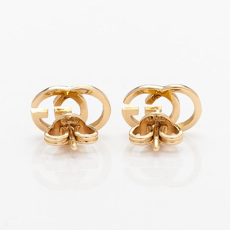 Gucci, a pair of 18K gold "GG Running" earrings.
