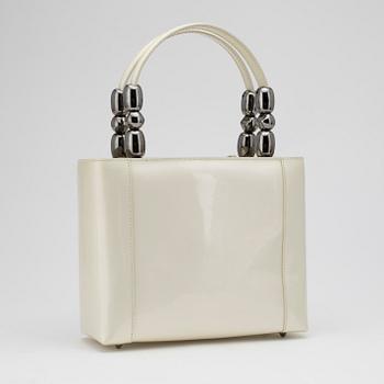 CHRISTIAN DIOR, a white patent leather handbag.