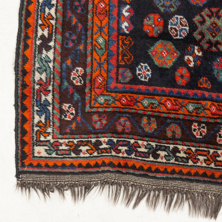 An old Shiraz rug, c. 240 x 155 cm.