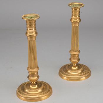 A pair of Empire bronze candlesticks, first half of the 19th century.